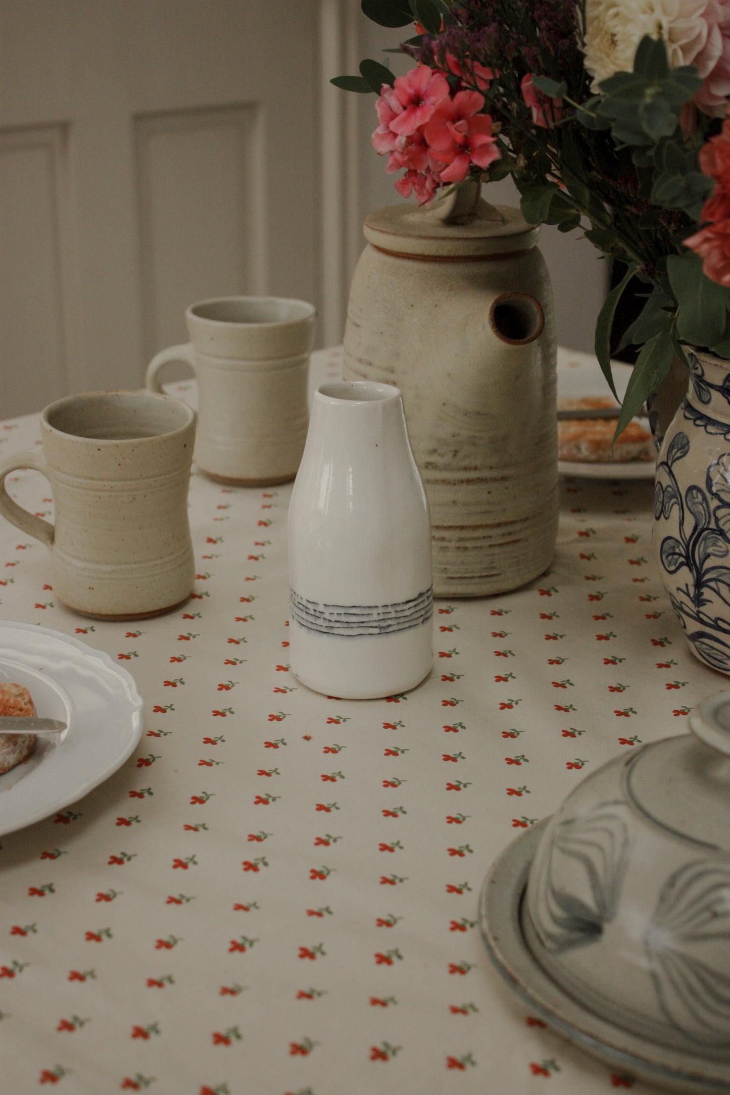 Studio pottery banded milk bottle vase