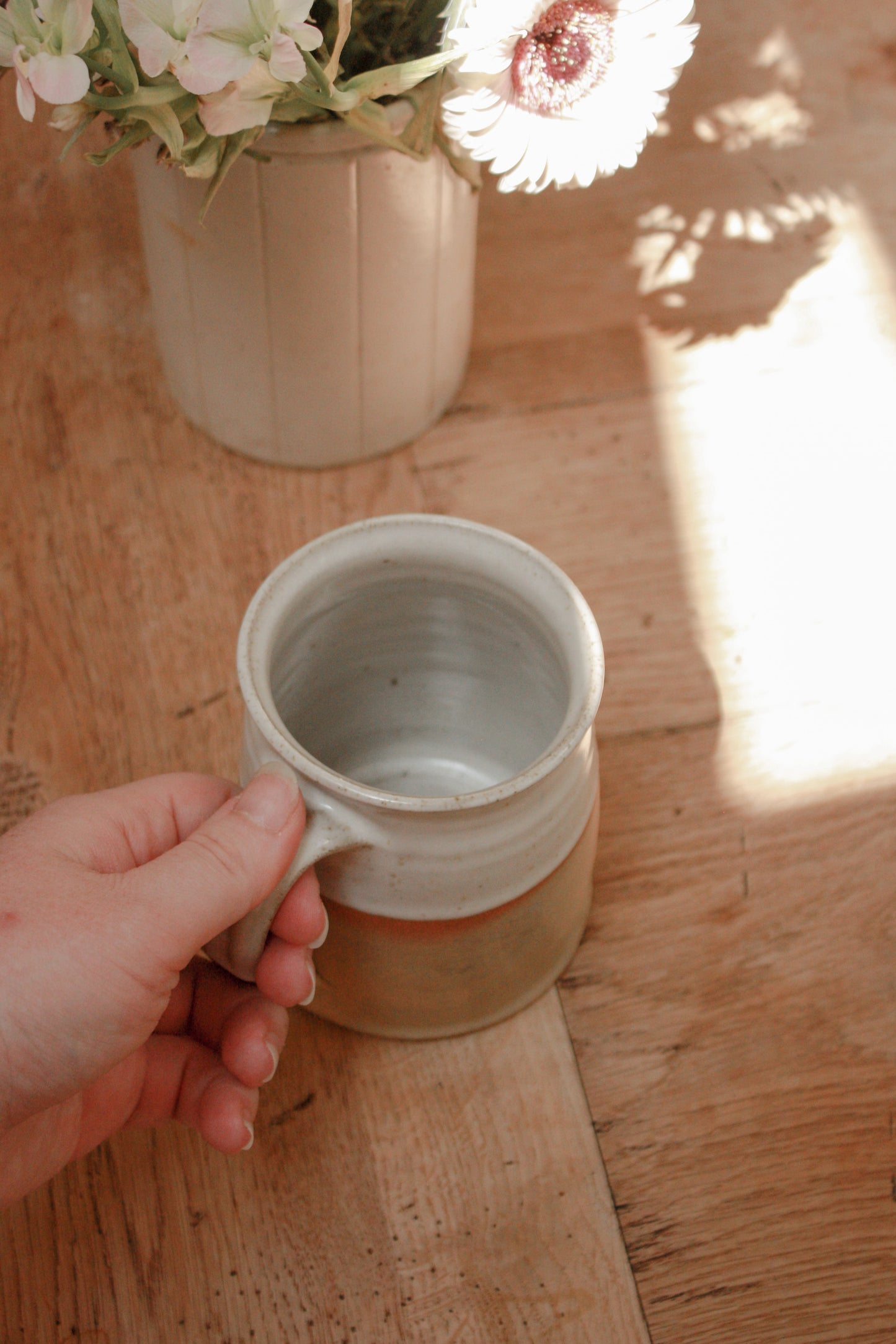 Studio pottery clay mug with rustic two tone glaze