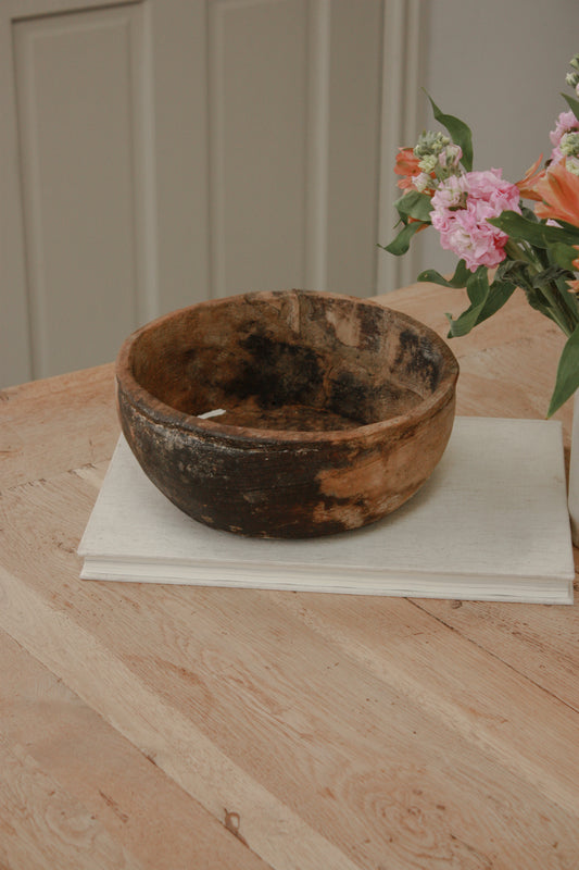 Vintage weathered and textured rustic wooden bowl