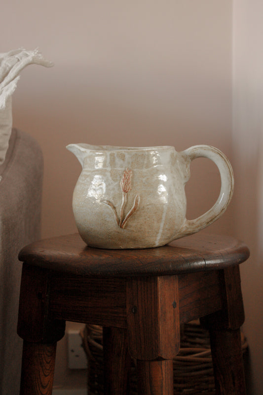 Vintage studio pottery pitcher with wheat design