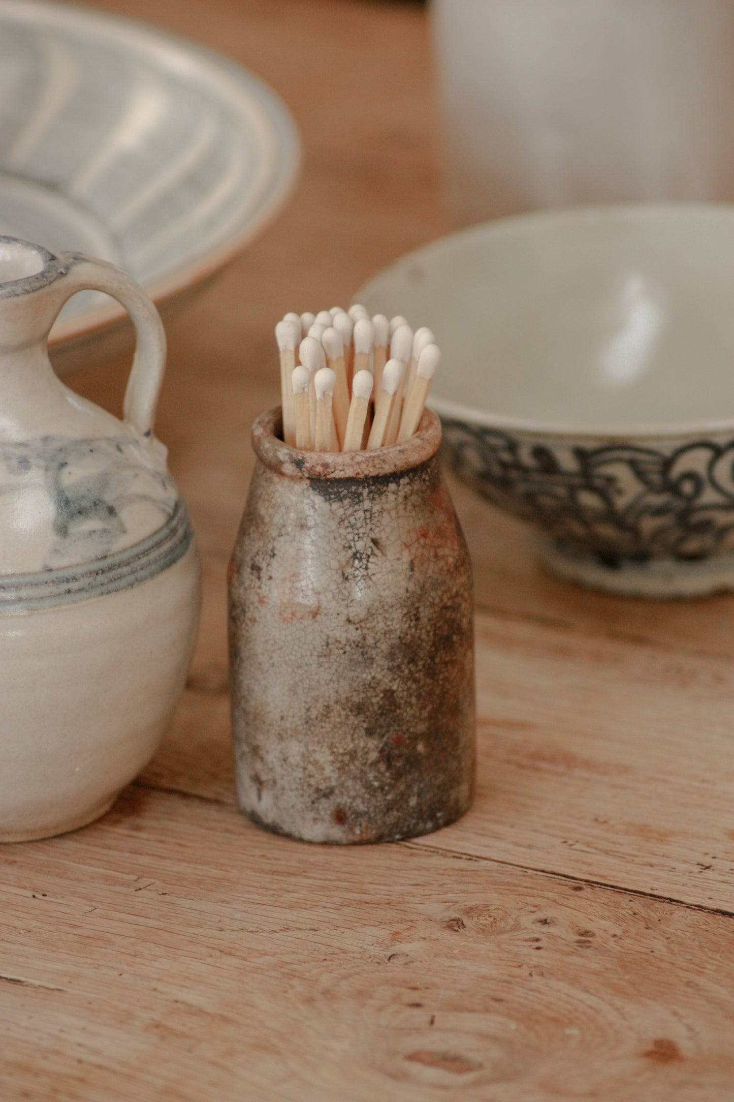 Vintage weathered and worn stoneware match pot