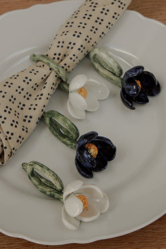Set of four folk art pottery flower napkin rings