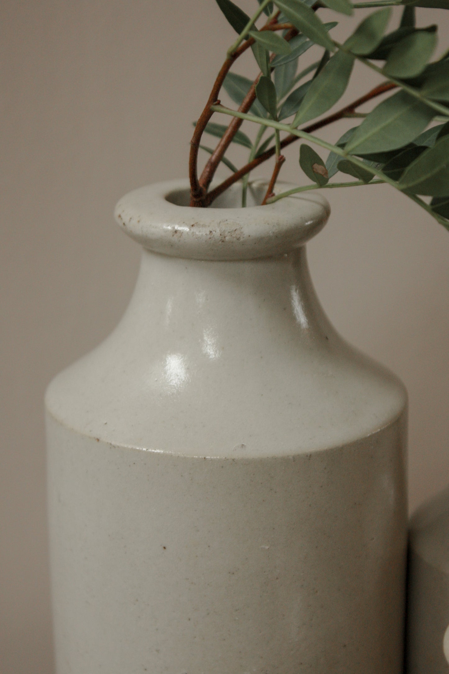 Vintage set of three pale stoneware bottles