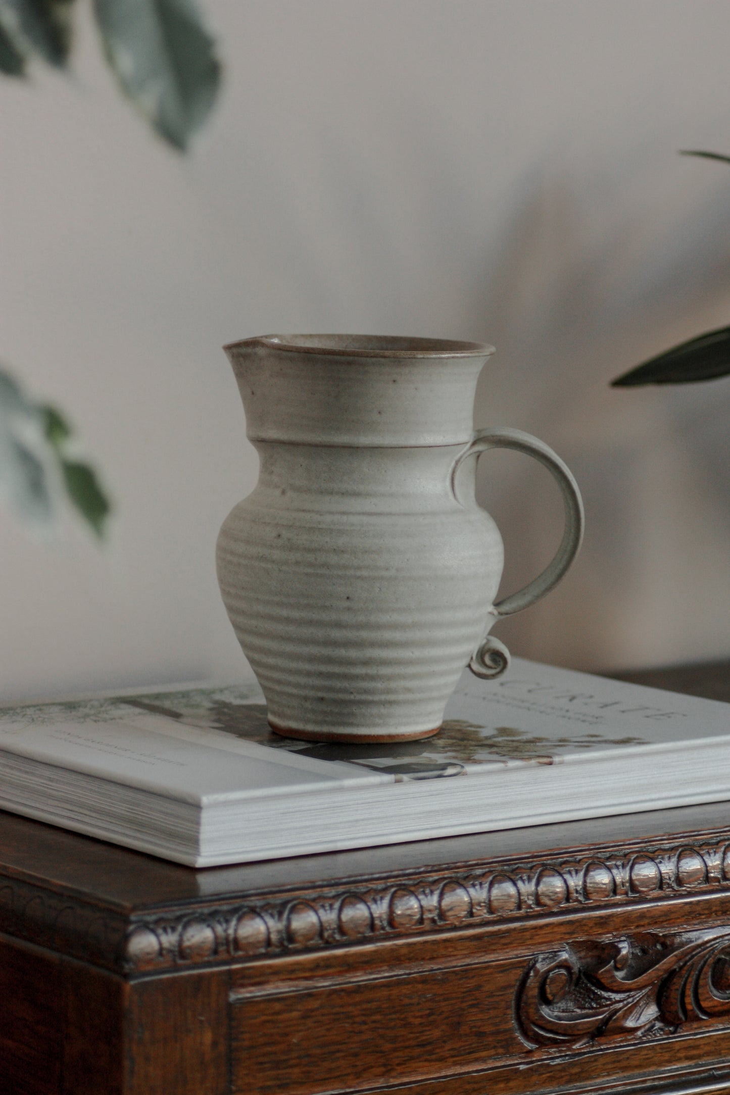 Vintage studio pottery pitcher with rustic glaze
