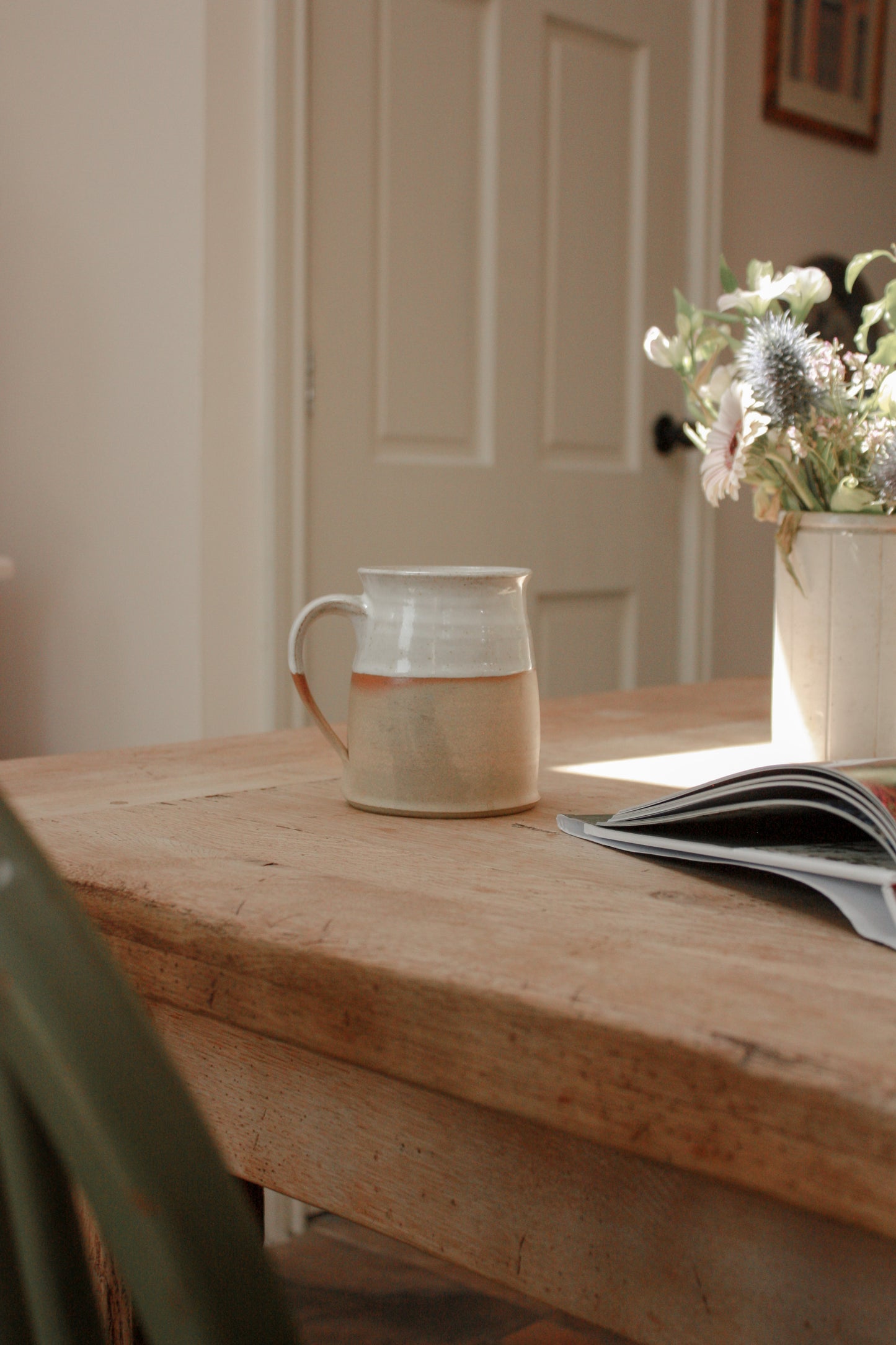 Studio pottery clay mug with rustic two tone glaze