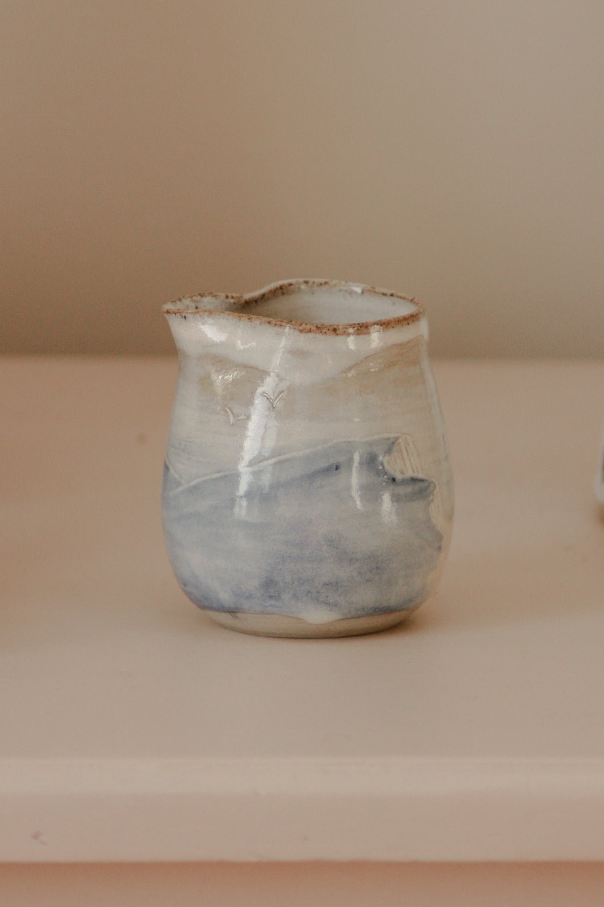 Contemporary studio art pottery cliff scene creamer