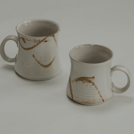 Pair vintage studio pottery mugs with neutral abstract design